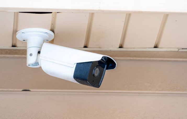 bullet type security camera installed on a roof