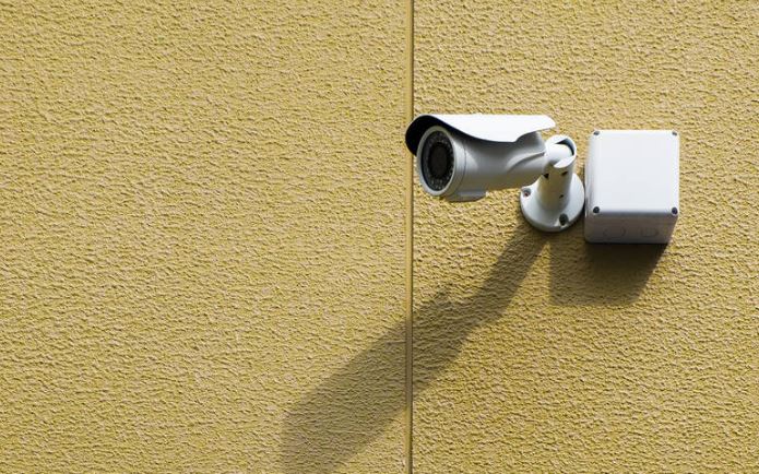 our corporate cctv installation process a security camera on an outside wall